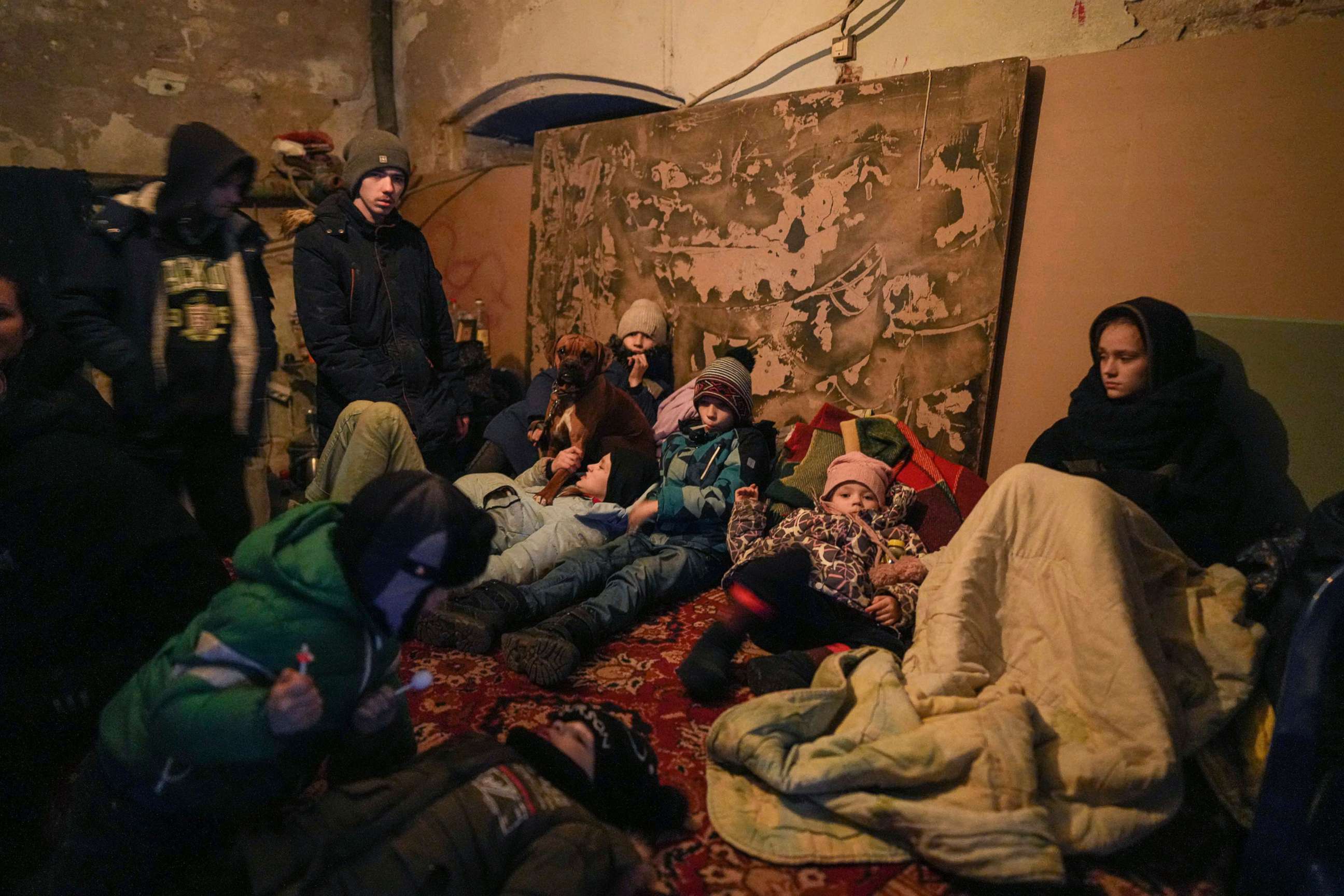 PHOTO: People huddle in the cold in a bomb shelter in Mariupol, Ukraine, March 6, 2022.