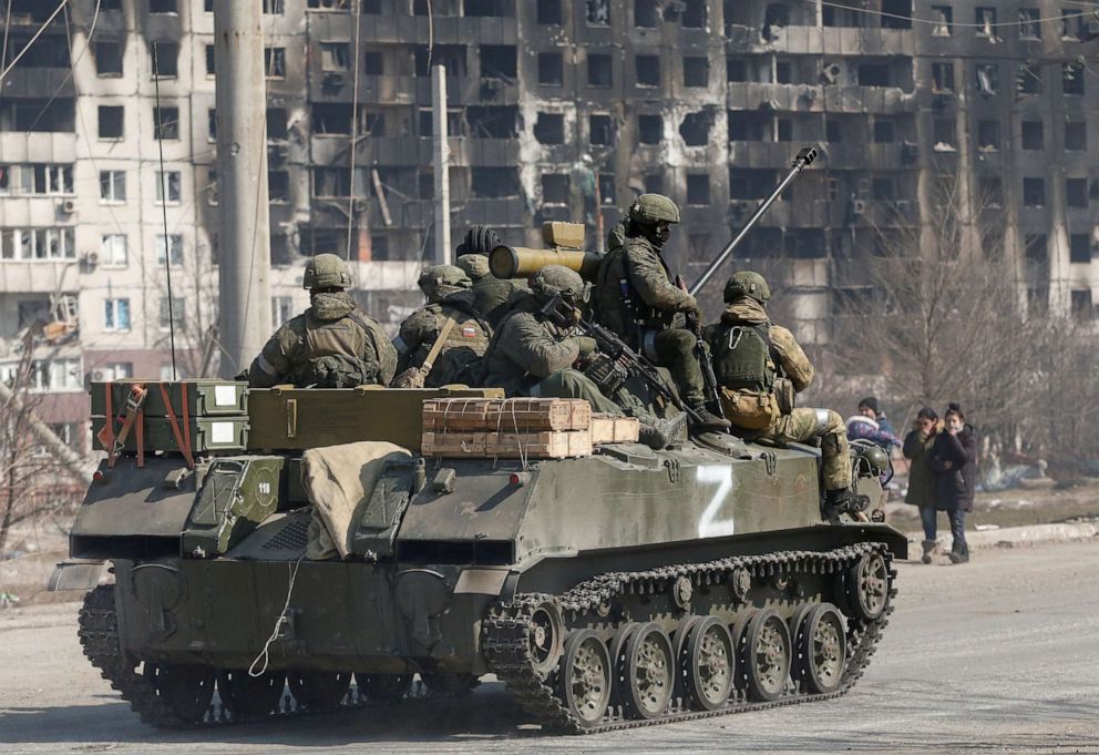PHOTO: Pro-Russian troops are seen atop of an armored vehicle with the symbol "Z" painted on its side in the besieged southern port city of Mariupol, Ukraine  on March 24, 2022.