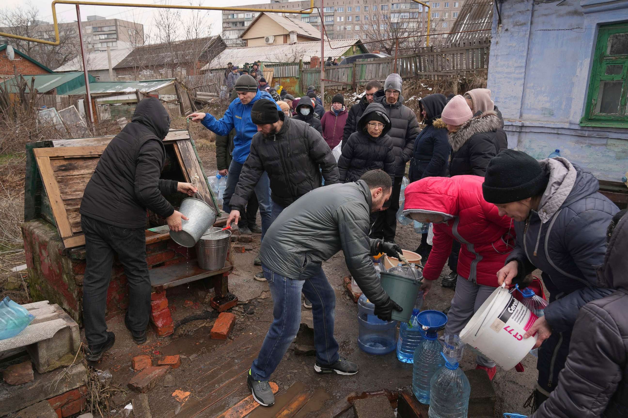 PHOTO: People line up to get water at the well in outskirts of Mariupol, Ukraine, March 9, 2022.