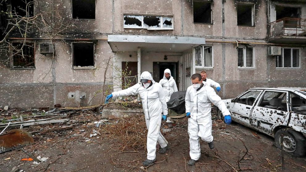 PHOTO: Emergency management specialists carry the body of a person killed during Ukraine-Russia conflict in the southern port city of Mariupol, Ukraine, April 21, 2022.