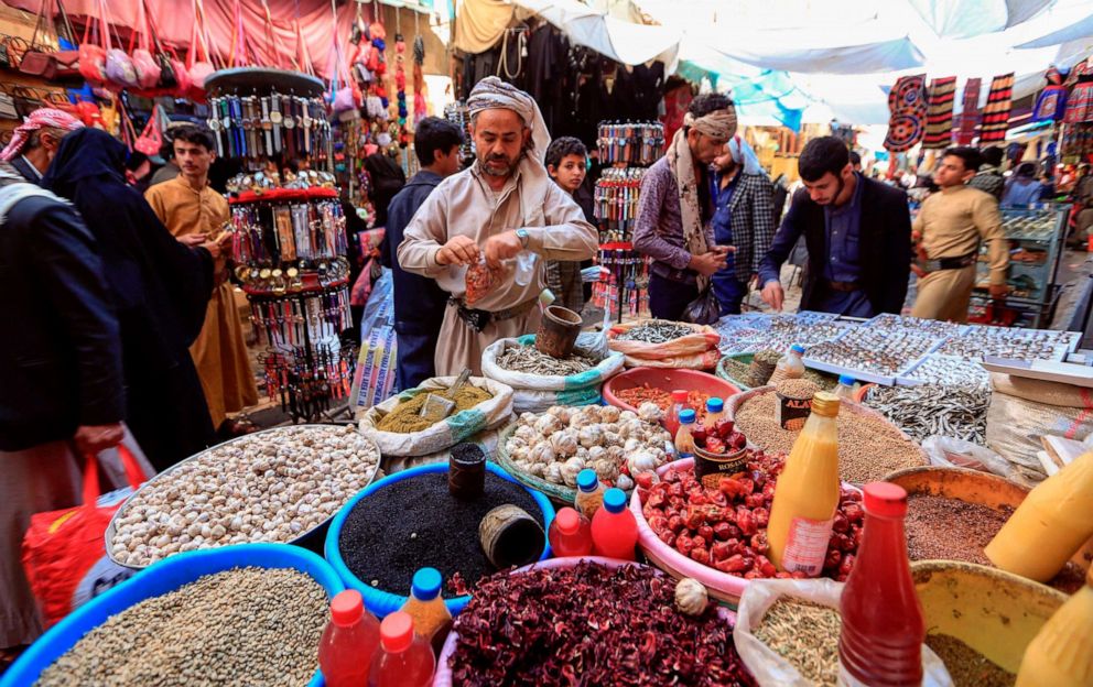 PHOTO: People shop in the old city market of Yemen's capital, Sanaa, ahead of the holy Muslim fasting month of Ramadan, on April 18, 2020.