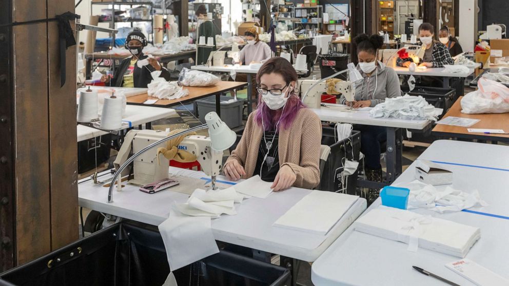PHOTO: Workers at Detroit Sewn, a contract sewing company, produce medical masks for medical professionals during the coronavirus crisis, April 2, 2020, in Pontiac, Mich. 