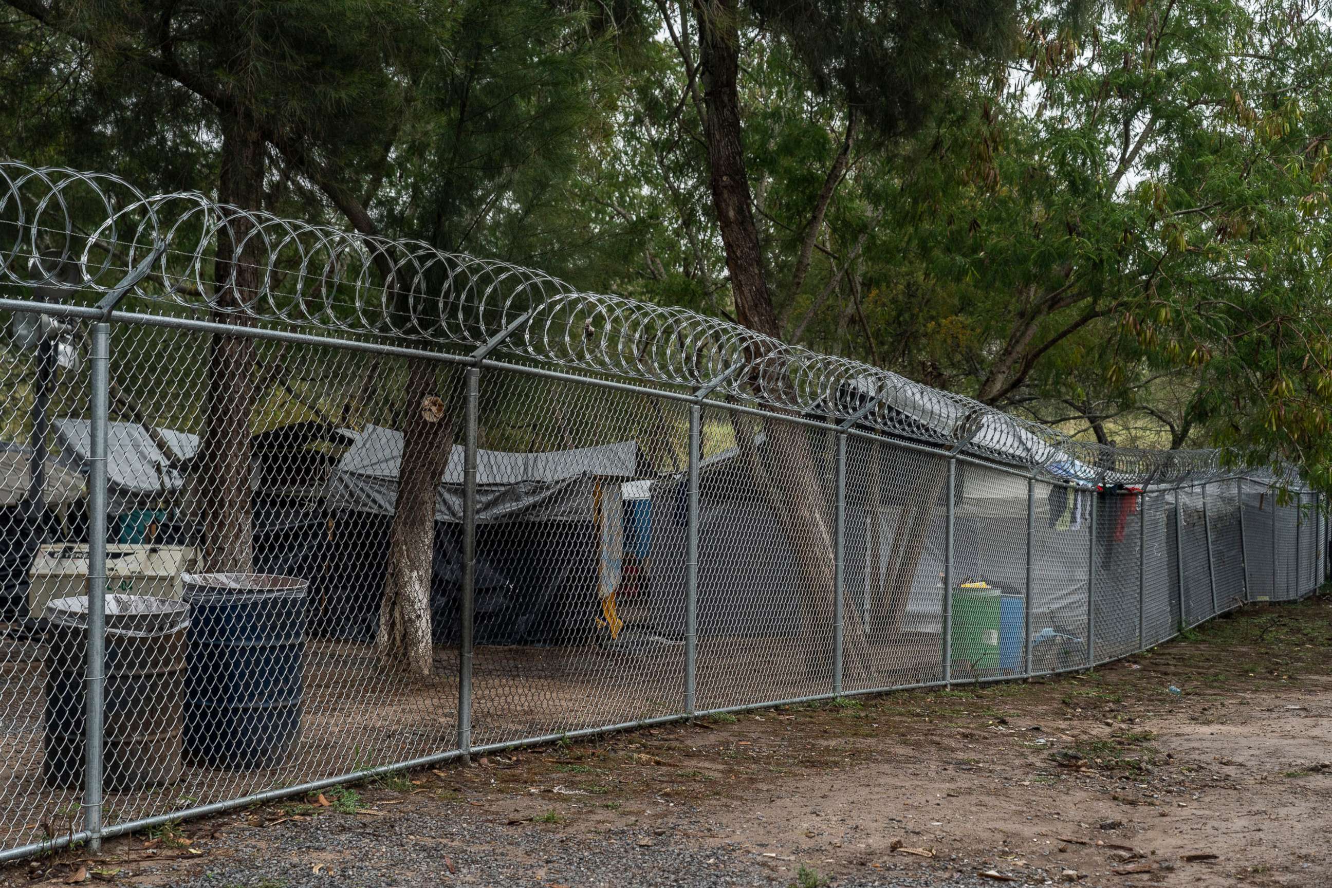 PHOTO: Fences and barbed wires are seen around the make-shift camp for asylum seekers on Feb. 14, 2021, in Matamoros, Mexico.