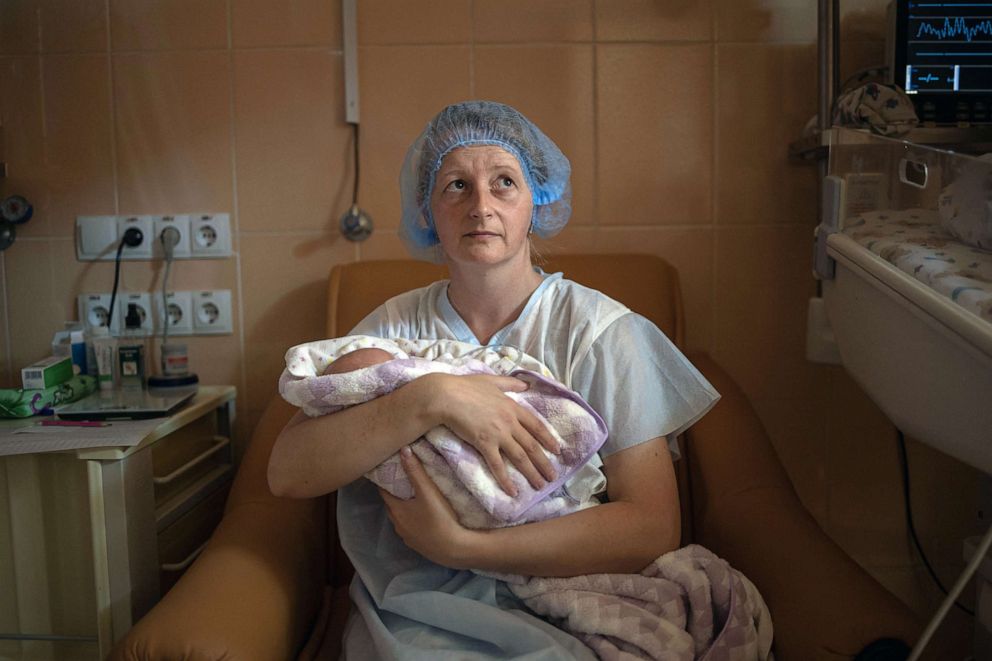 PHOTO: Katya Buravtsova, 35, holds her son Illiusha inside Pokrovsk maternity hospital, Donetsk region, eastern Ukraine, June 29, 2022.