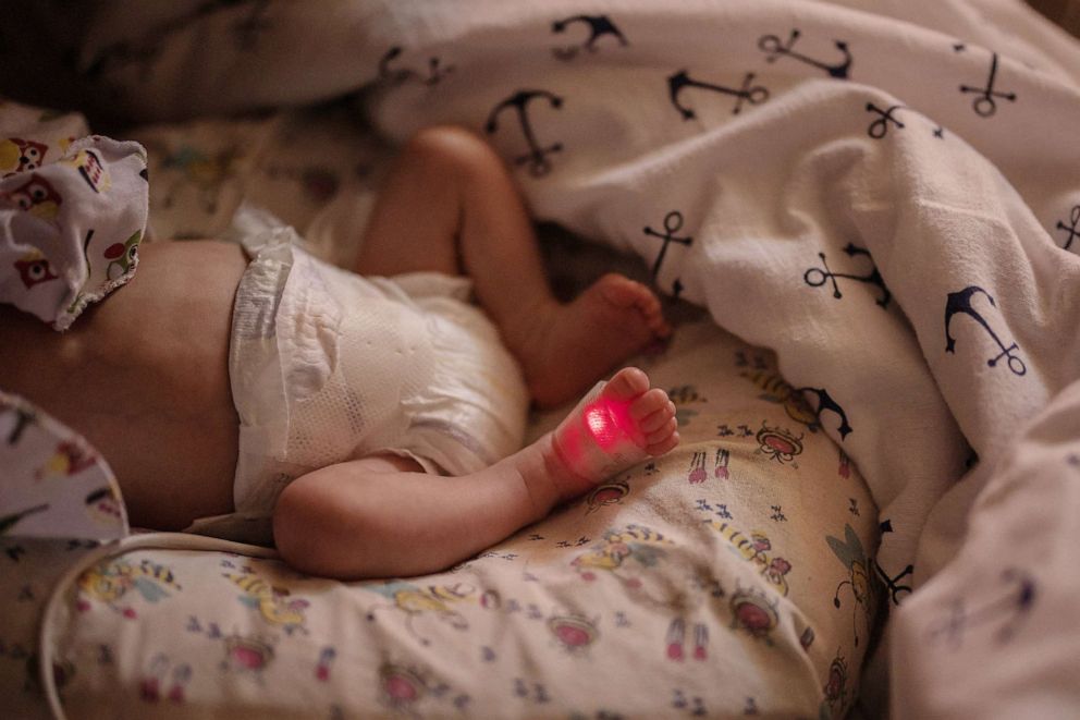 PHOTO: Baby Illiusha rests inside Pokrovsk maternity hospital, Donetsk region, eastern Ukraine, June 28, 2022.