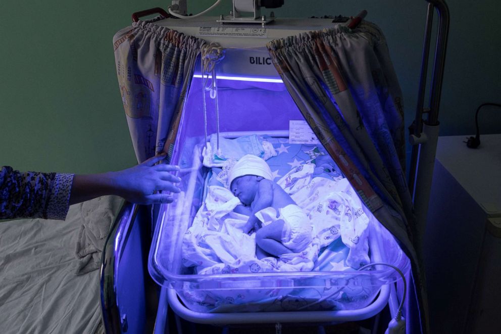 PHOTO: Elena Derdel, 33, checks on her daughter Vanhelia inside Pokrovsk maternity hospital, Donetsk region, eastern Ukraine, July 6, 2022.