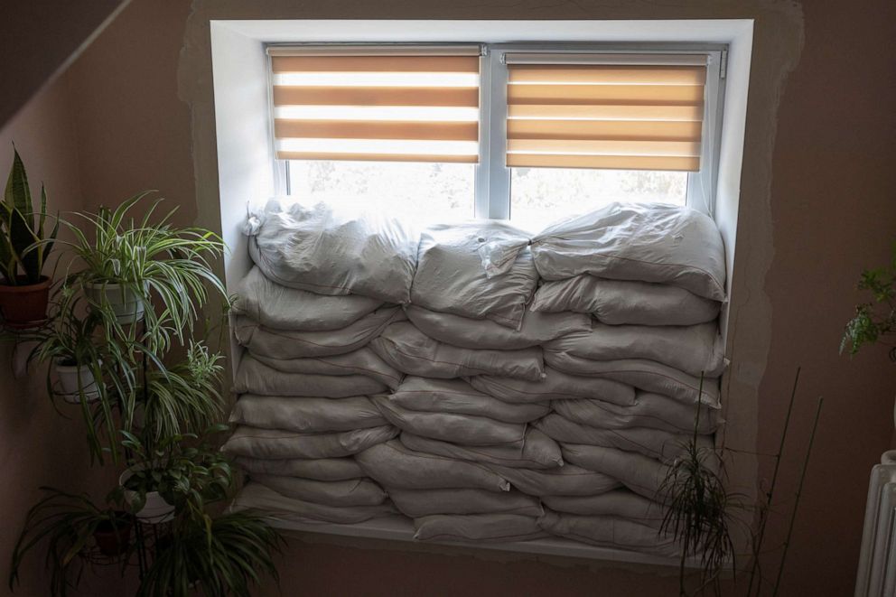 PHOTO: Sandbags are seen piled in front of a window inside Pokrovsk maternity hospital, Donetsk region, eastern Ukraine, June 29, 2022.