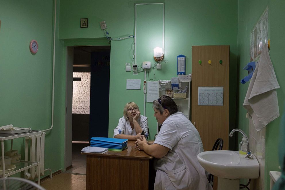 PHOTO: Nurses sit inside Pokrovsk maternity hospital, Donetsk region, eastern Ukraine, July 6, 2022.