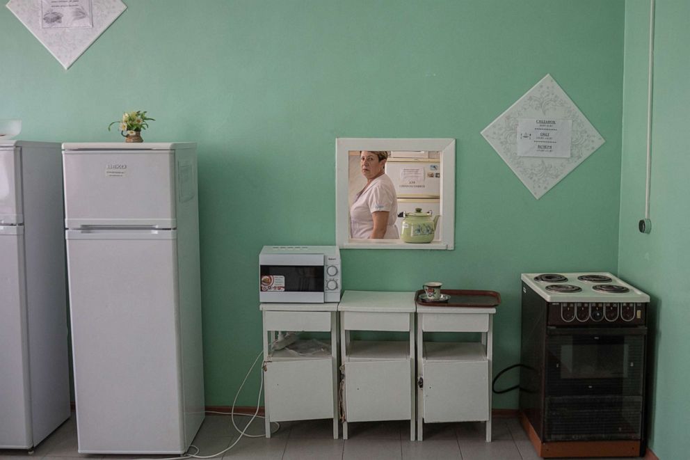 PHOTO: A nurse walks in a kitchen at Pokrovsk maternity hospital, Donetsk region, eastern Ukraine, July 6, 2022. 