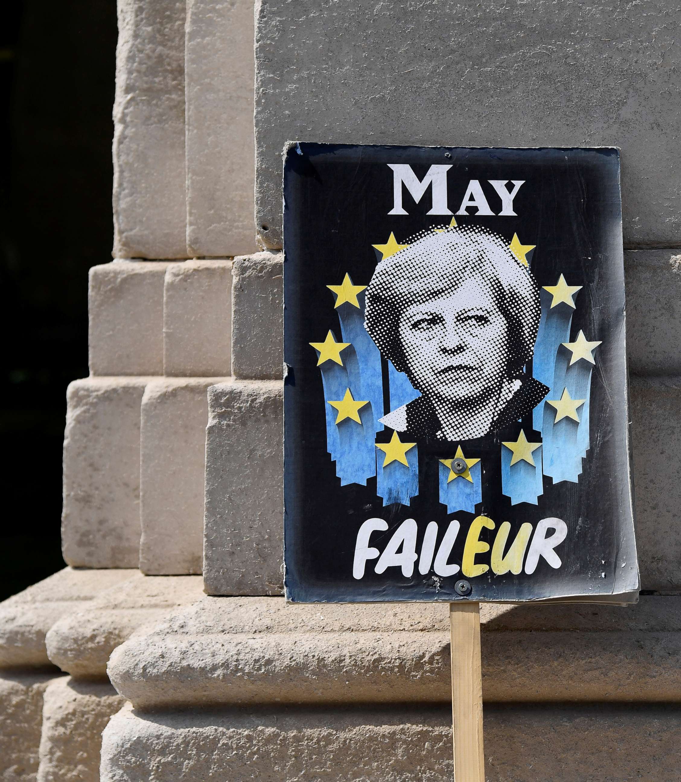PHOTO: An anti-Brexit placard depicting Britain's Prime Minister Theresa May near the Houses of Parliament in London, May 16, 2019.