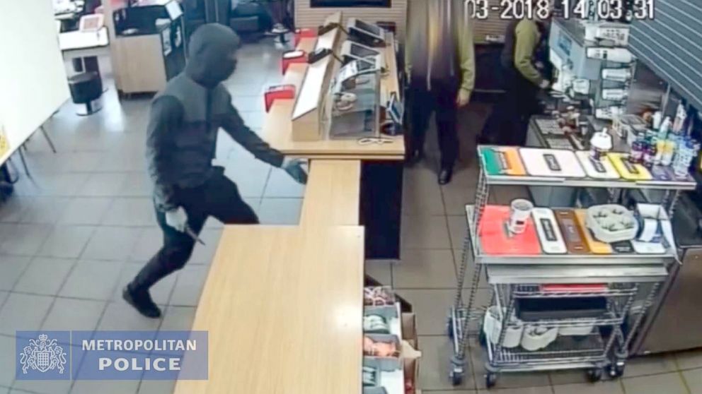 PHOTO: A robber, who stole a box of promotional Monopoly cards and vouchers from a McDonald's chain, is caught on CCTV, March 23, 2018, in London.