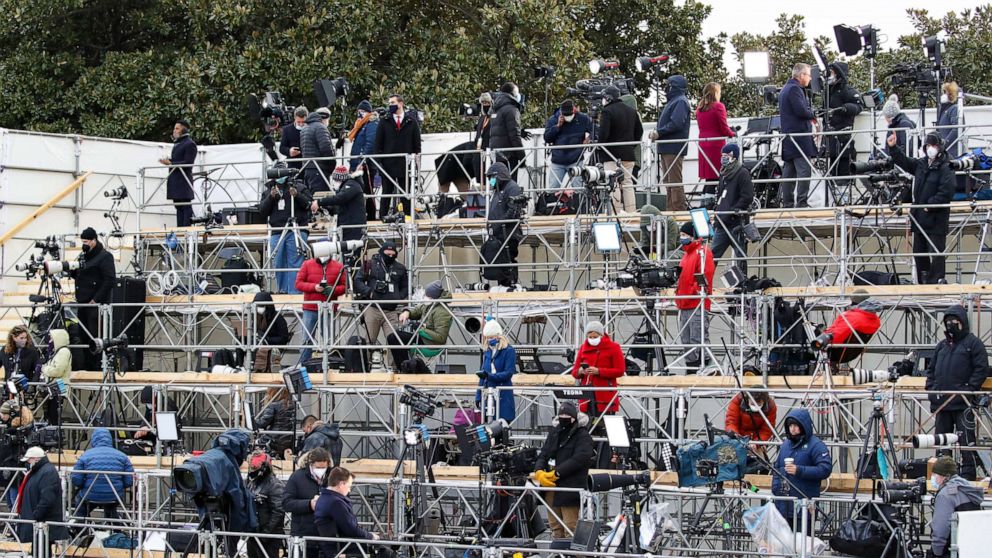 PHOTO: Members of the media work on the social-distanced riser at the inauguration of President-elect Joe Biden on the West Front of the Capitol, Jan. 20, 2021, in Washington, D.C.