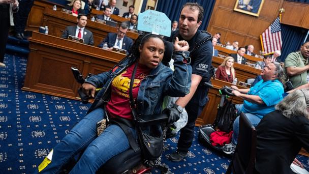 Demonstrators calling for preservation of Medicaid funding, are removed from the House Energy and Commerce markup of the FY2025 budget resolution in Rayburn building, May 13, 2025.