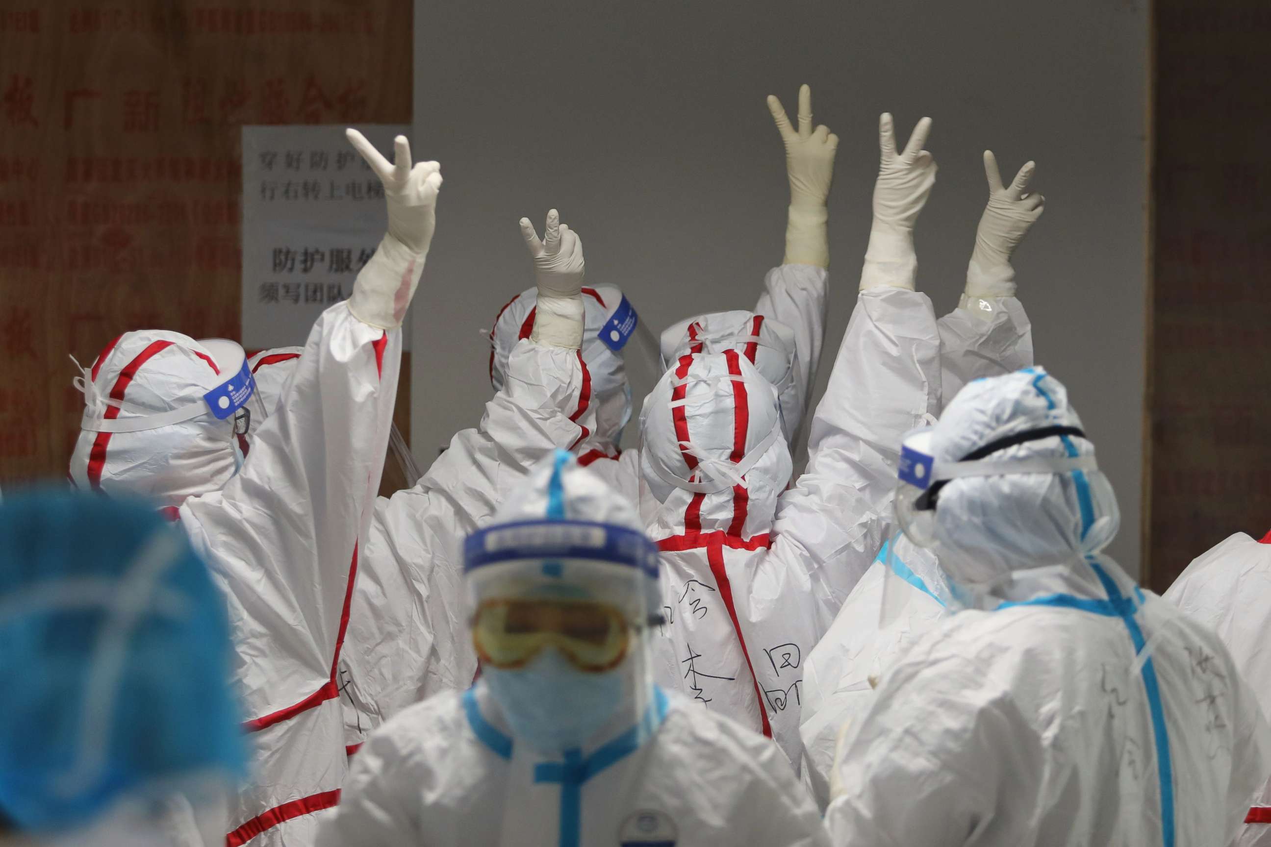 PHOTO: Medical staff cheer themselves up before going into an ICU ward for patients infected with the novel coronavirus at the Red Cross Hospital in Wuhan in China's central Hubei province on March 16, 2020.
