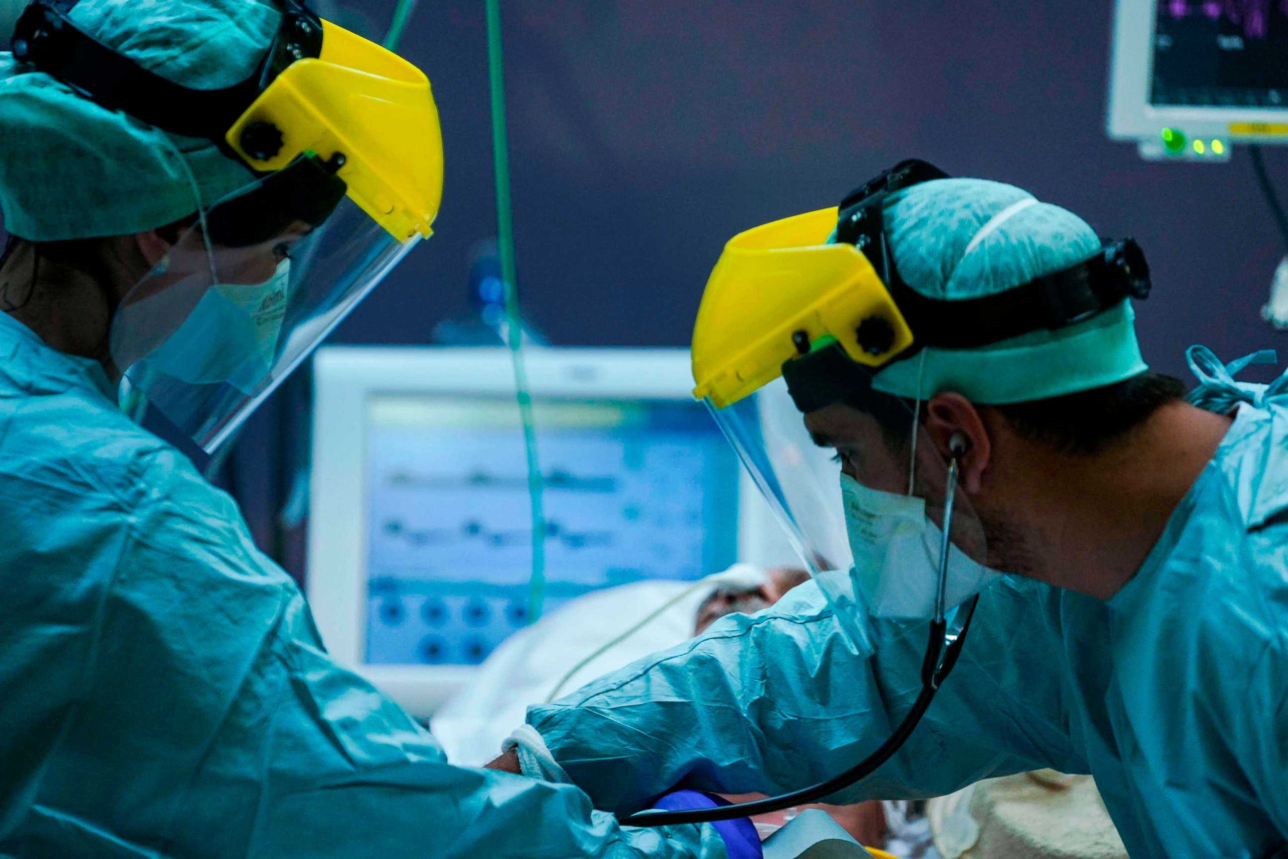 PHOTO: Medical workers wearing protective gear work at an intensive care unit for patients diagnosed with the novel coronavirus at Erasmus Hospital in Brussels on March 25, 2020, during a national lockdown in Belgium to curb the spread of the virus.
