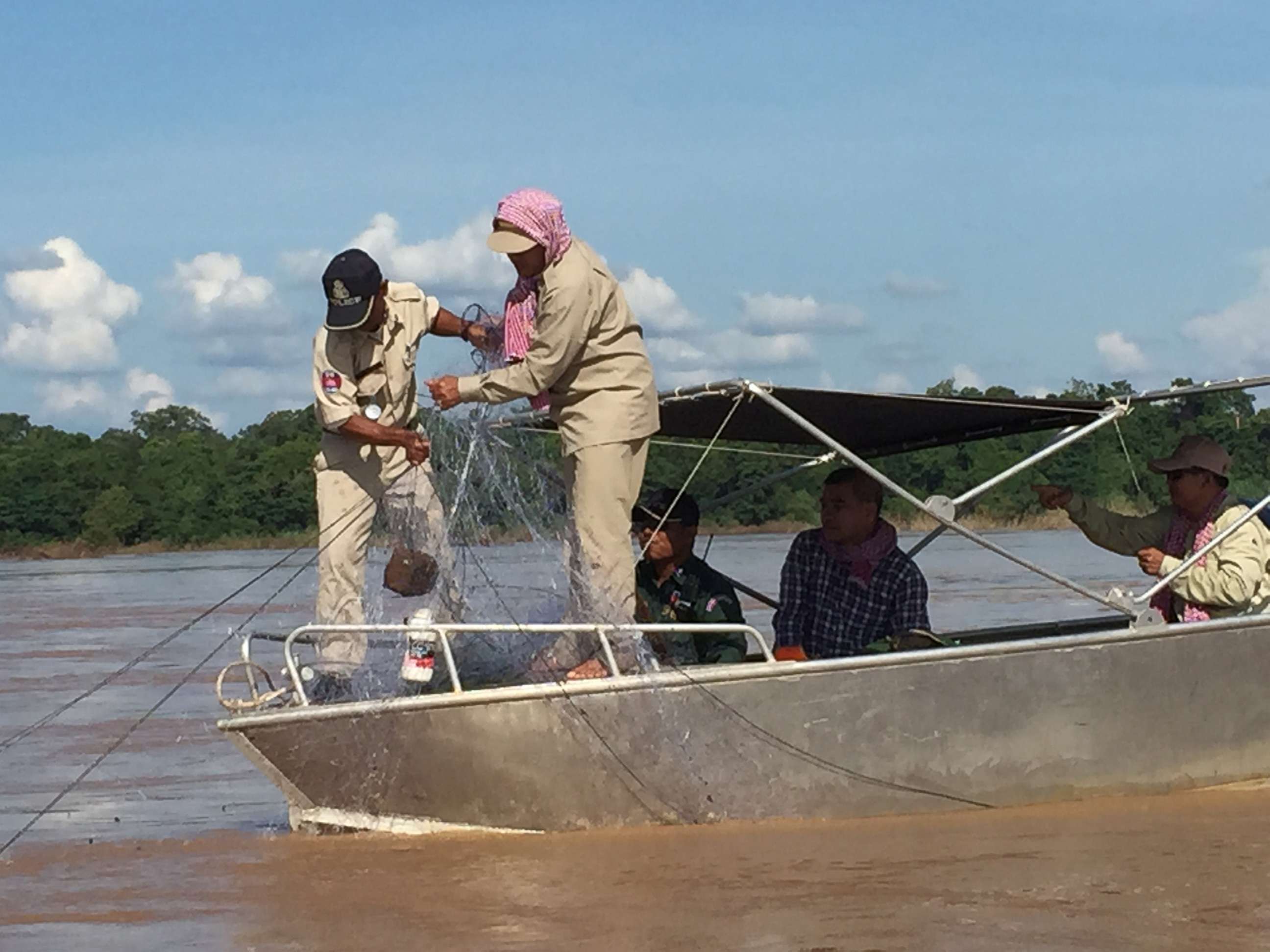 PHOTO: River guards confiscate illegal fishing nets along a protected area of the Mekong river in Cambodia where Irrawaddy river dolphins are critically endangered.