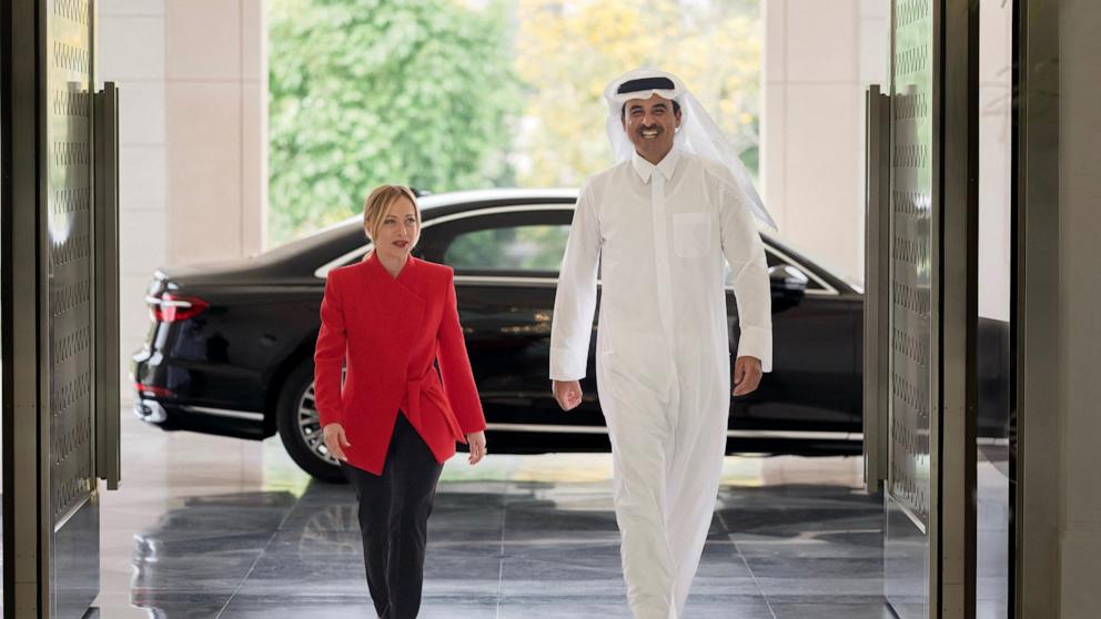 PHOTO: This handout photograph taken and released by Qatar's Amiri Diwan shows Qatar's Emir Sheikh Tamim bin Hamad Al-Thani receiving Italy's Prime Minister Giorgia Meloni during their meeting at Lusail Palace on April 4, 2026.