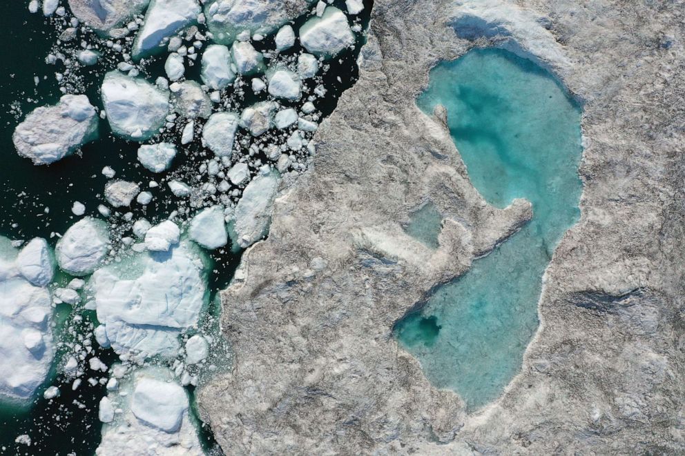 PHOTO: In this July 30, 2019, file photo, melting ice forms a lake on free-floating ice jammed into the Ilulissat Icefjord near Ilulissat, Greenland, during unseasonably warm weather.