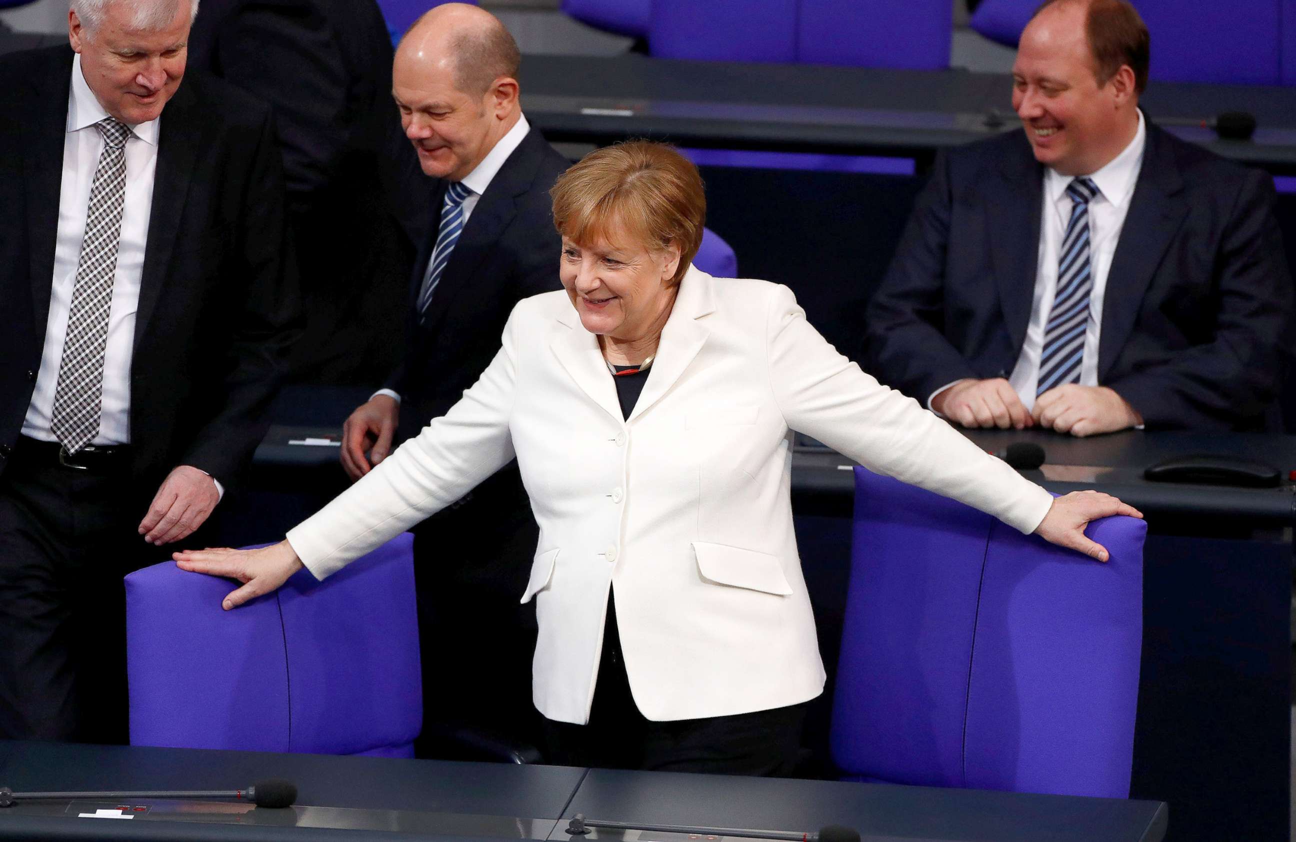 PHOTO: German Chancellor Angela Merkel takes her seat before the swearing-in ceremony of her government in Germany's lower house of parliament Bundestag in Berlin, Germany, March 14, 2018.