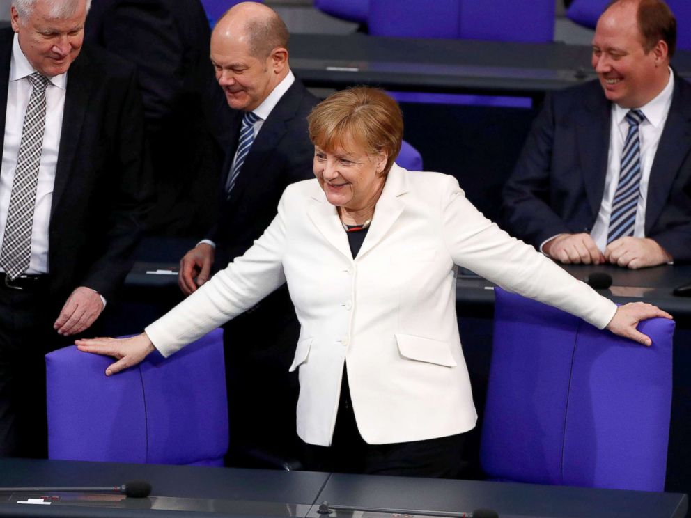PHOTO: German Chancellor Angela Merkel takes her seat before the swearing-in ceremony of her government in Germanys lower house of parliament Bundestag in Berlin, Germany, March 14, 2018.
