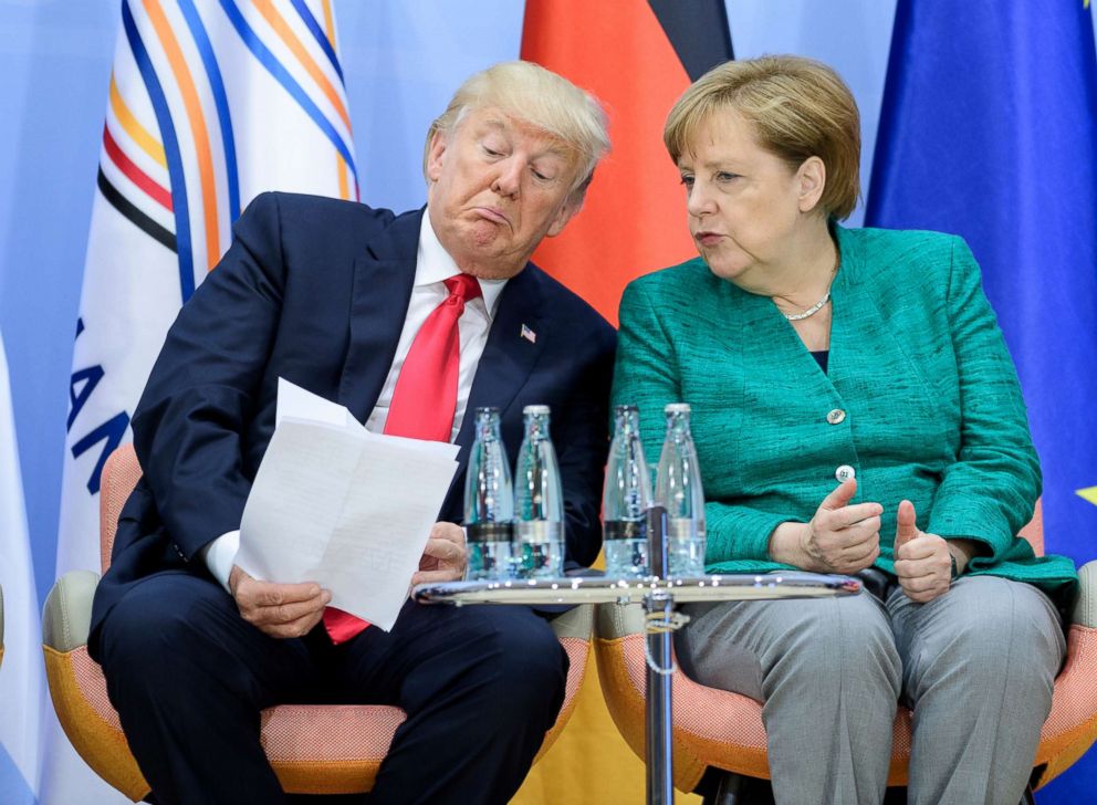 PHOTO: President Donald Trump and German Chancellor Angela Merkel attend a panel discussion on the second day of the G20 summit, July 8, 2017 in Hamburg, Germany.
