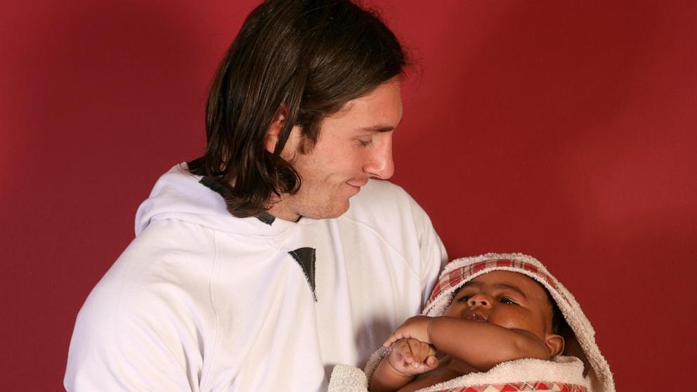 PHOTO: Twenty-year-old soccer star Lionel Messi cradles Lamine Yamal, who was merely six months old at the time during a photo session in Sept. 2007 in the dressing room of the Camp Nou stadium in Barcelona, Spain. 