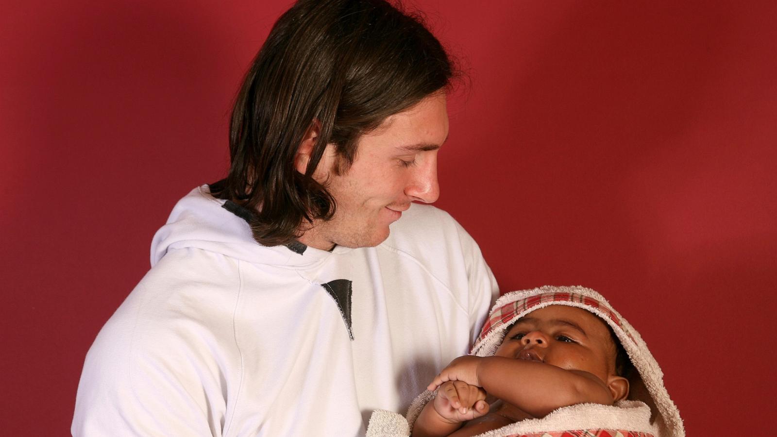 PHOTO: Twenty-year-old soccer star Lionel Messi cradles Lamine Yamal, who was merely six months old at the time during a photo session in Sept. 2007 in the dressing room of the Camp Nou stadium in Barcelona, Spain.