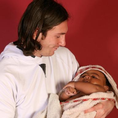 PHOTO: Twenty-year-old soccer star Lionel Messi cradles Lamine Yamal, who was merely six months old at the time during a photo session in Sept. 2007 in the dressing room of the Camp Nou stadium in Barcelona, Spain. 