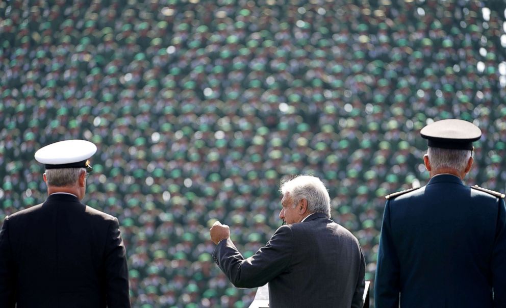 PHOTO: Mexican President-elect Andres Manuel Lopez Obrador, flanked by Defense Minister General Salvador Cienfuegos and Secretary of the Navy Admiral Vidal Francisco Soberon, addresses troops at Military Camp 1, in Mexico City, Mexico Nov. 25, 2018. 