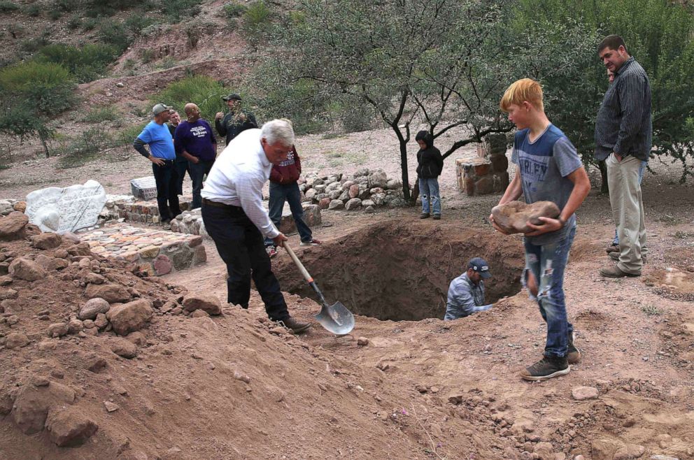 PHOTO: Men dig a mass grave for some of the women and children related to the extended LeBaron family before their burial at the cemetery in La Mora, Sonora state, Mexico, Nov. 7, 2019.