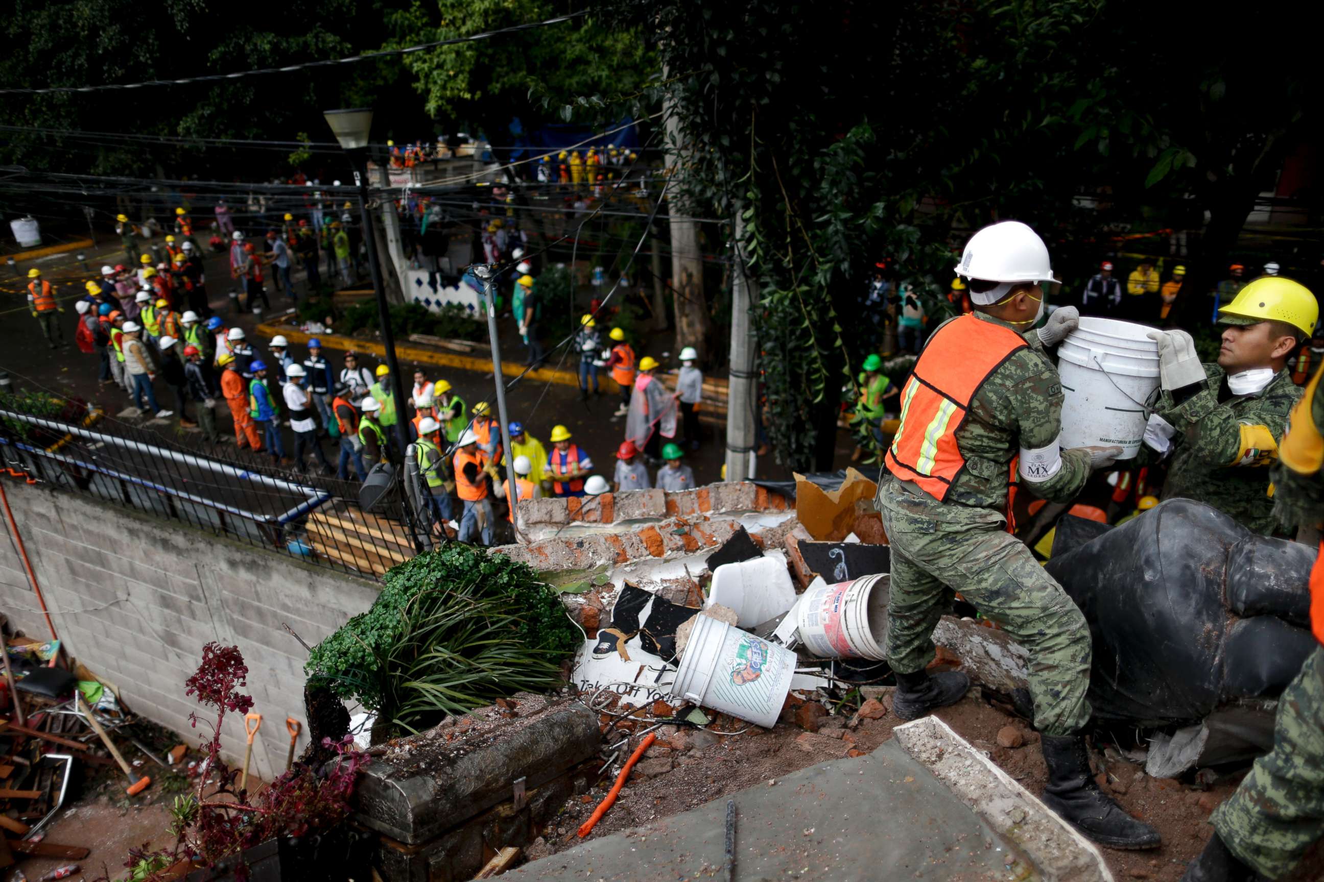 PHOTO: Rescue workers search for survivors at an apartment building that collapsed after an earthquake in Mexico City, Mexico, Sept. 21, 2017.