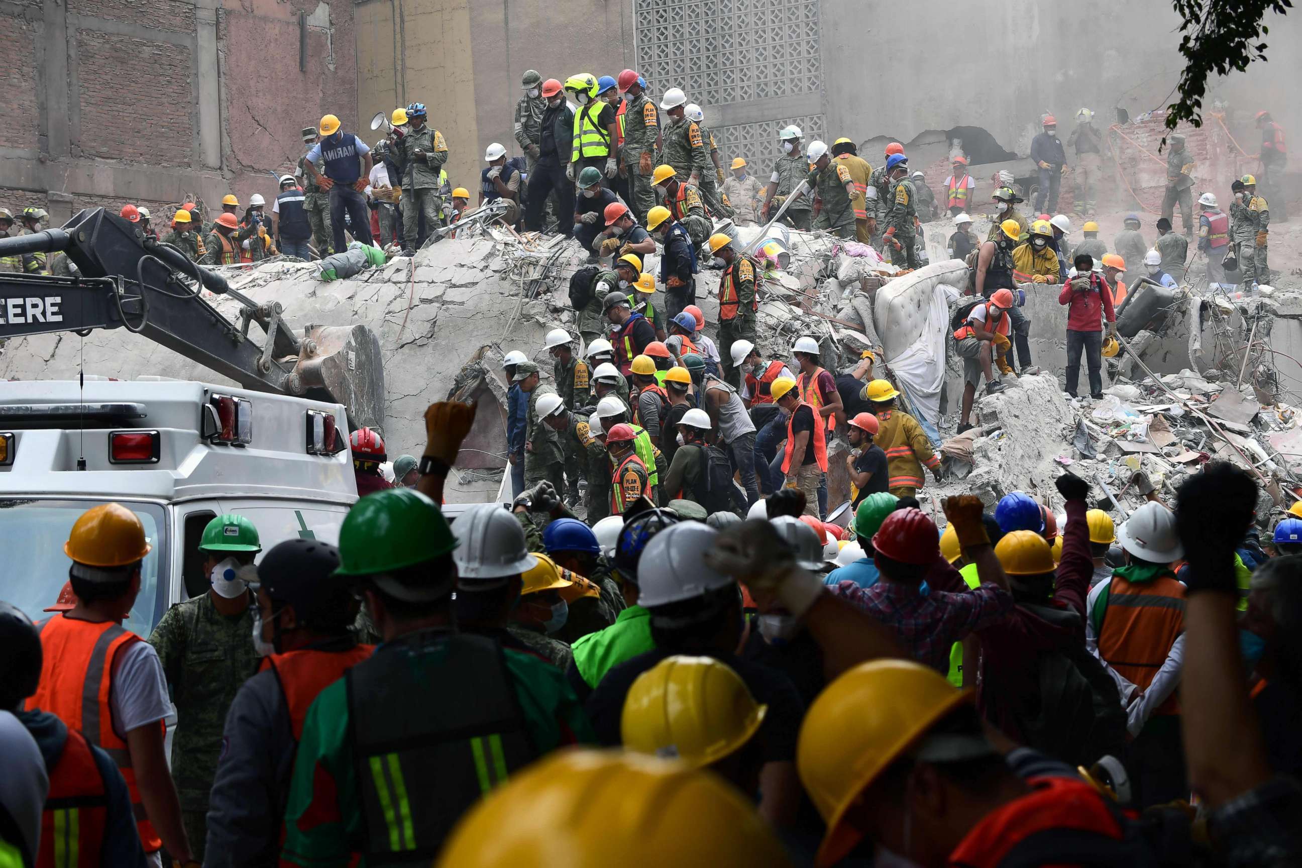 PHOTO: Rescue workers and volunteers search for survivors in a toppled building in Mexico City, Sept. 21, 2017.