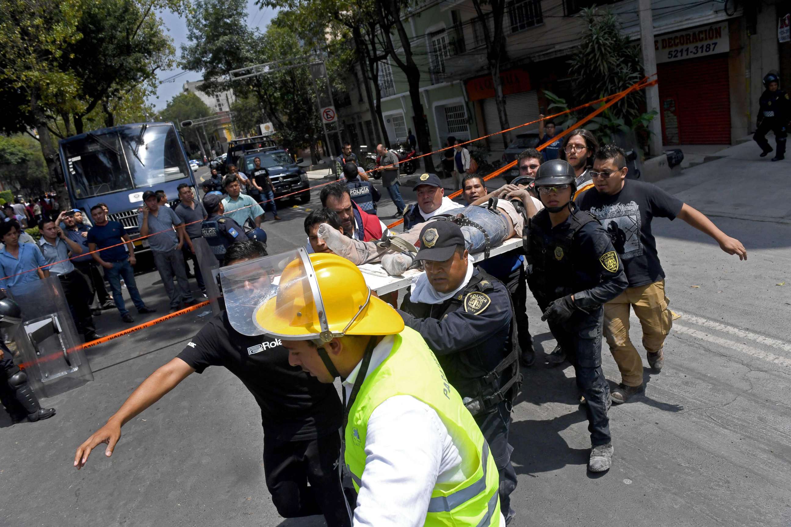 PHOTO: Rescuers carry on a stretcher a person wounded during a quake in Mexico City, Sept. 19, 2017.