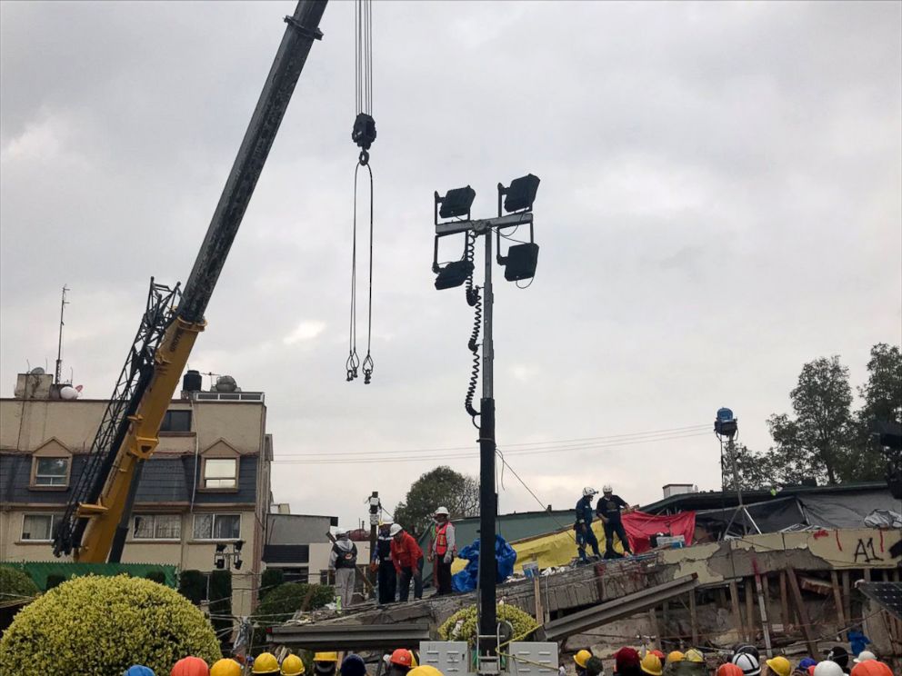 PHOTO: Rescue workers use a crane to lift parts of building that was destroyed by an earthquake in hopes to find survivors, Sept. 21, 2017, in Mexico City.