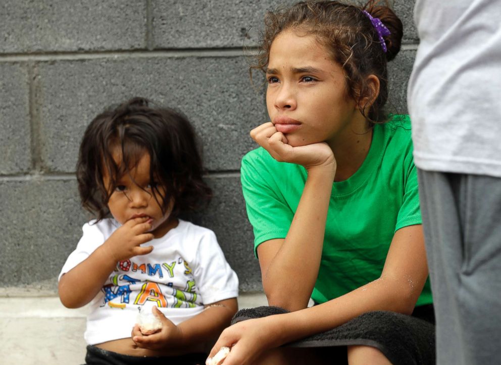 PHOTO: Angui Funes, right, sits with her brother, Jesus, after crossing the border back to Reynosa, Mexico, June 21, 2018.