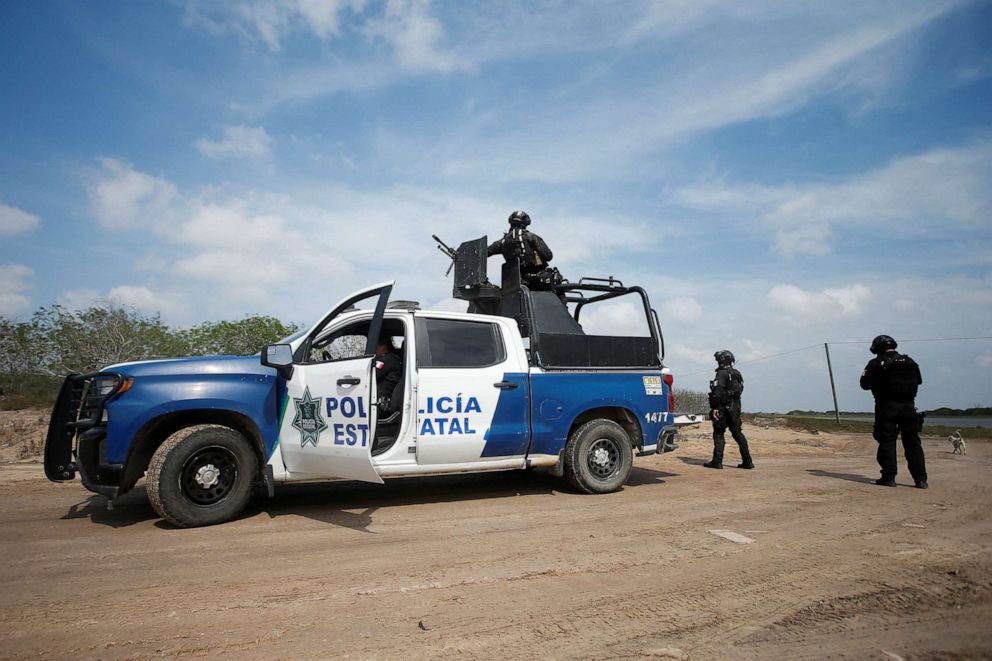 PHOTO: State police officers keep watch at the scene where authorities found the bodies of two of four Americans kidnapped by gunmen, in Matamoros, Mexico, March 7, 2023.