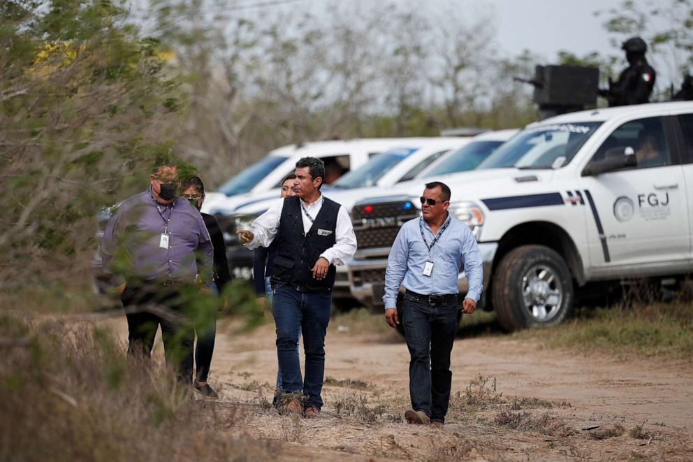 PHOTO: In this March 7, 2023, file photo, Tamaulipas attorney general's office personnel walk at the scene where authorities found the bodies of two of four Americans kidnapped by gunmen, in Matamoros, Mexico.