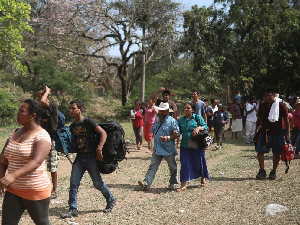 Central American migrants arrive to a sports center during the annual Migrant Stations of the Cross caravan, organized by the Pueblo Sin Fronteras activist group, as the group makes a stop in Matias Romero, Oaxaca, Mexico, Monday, April 2, 2018.