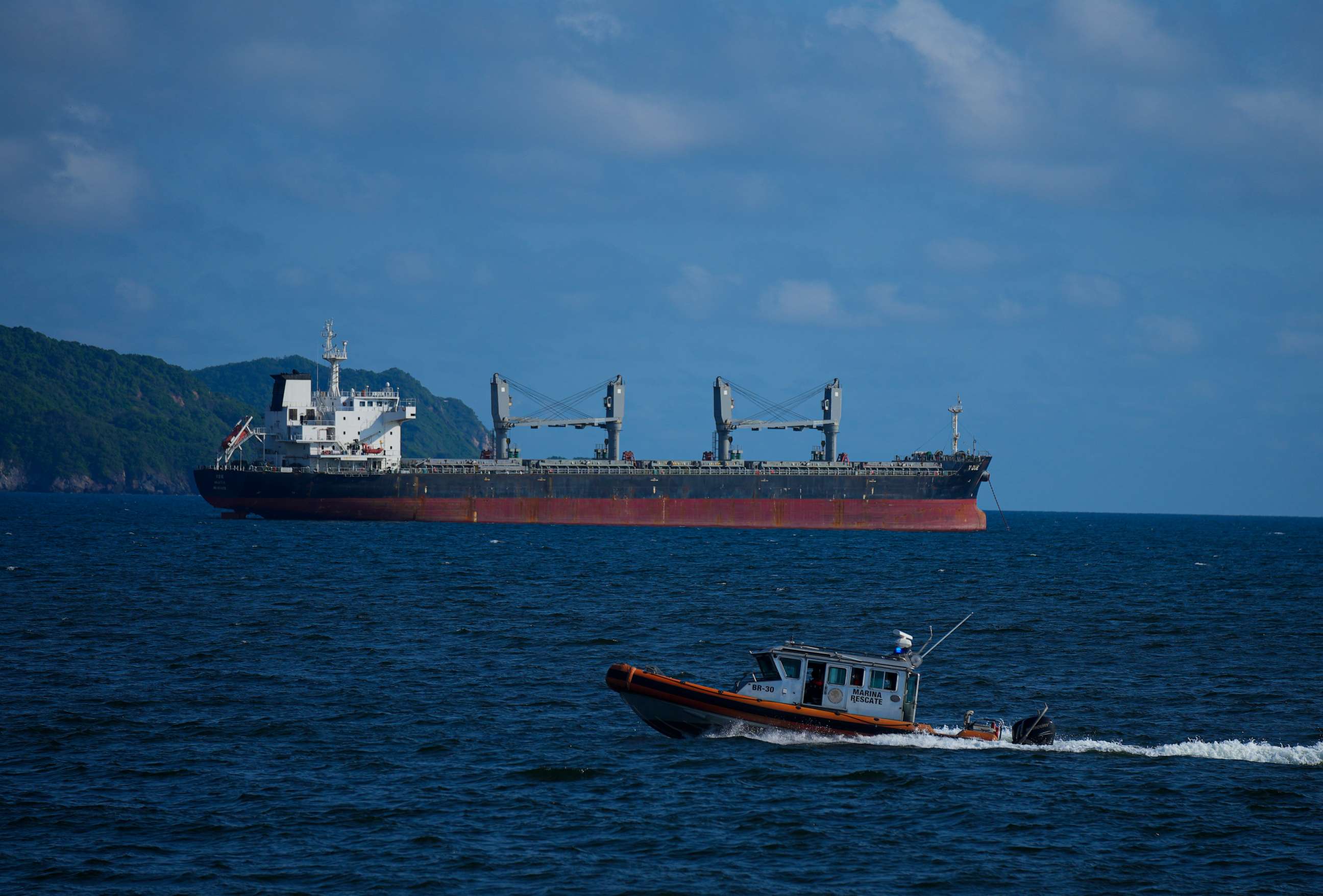 PHOTO: A Mexican Navy speedboat patrols near a cargo ship leaving the port of Manzanillo, Mexico, Wednesday, July 19, 2023.