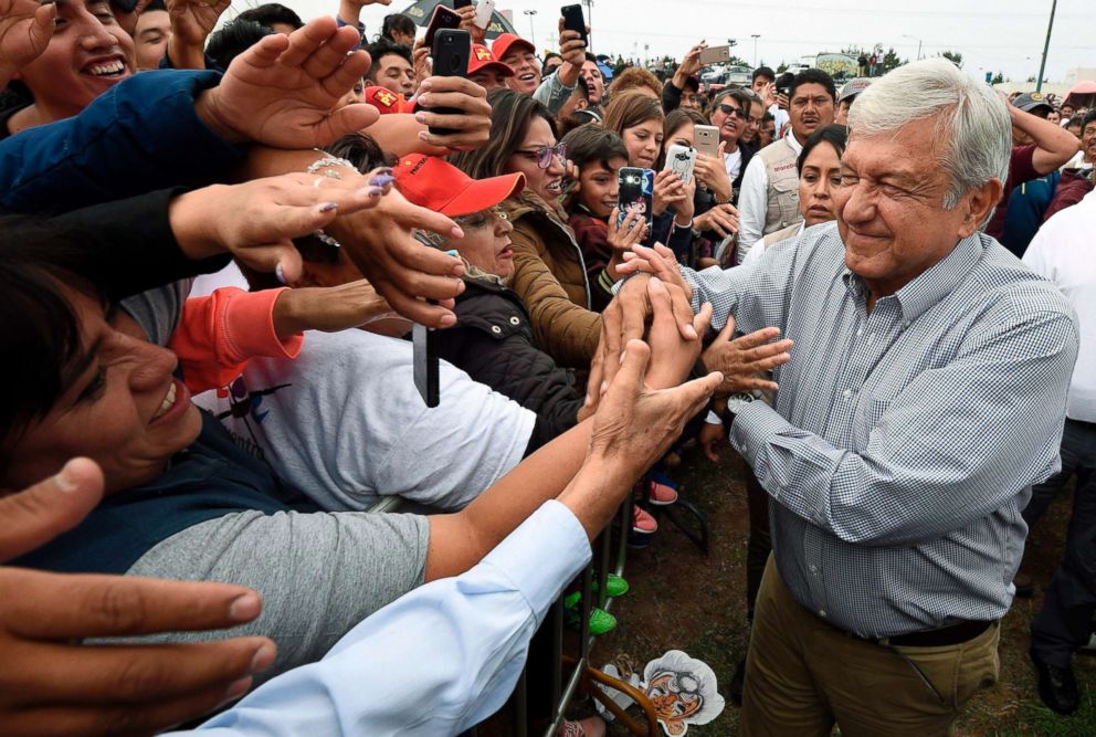 PHOTO: Mexico's presidential candidate Andres Manuel Lopez Obrador greets supporters during a campaign rally in Los Reyes Acaquilpan, Mexico, June 20, 2018 ahead of the upcoming July 1 national election.