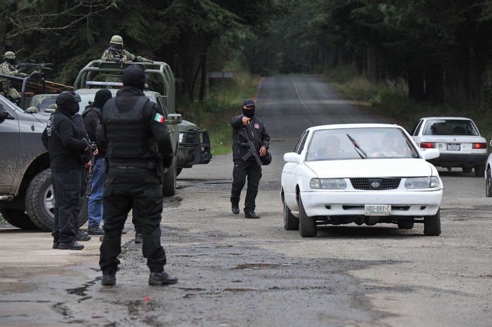 PHOTO: Police and military personnel stop a vehicle as they search for a French and a Mexican citizen who were kidnapped in Texcaltitlan, southwest Toluca, central Mexico, on Nov. 25, 2019.