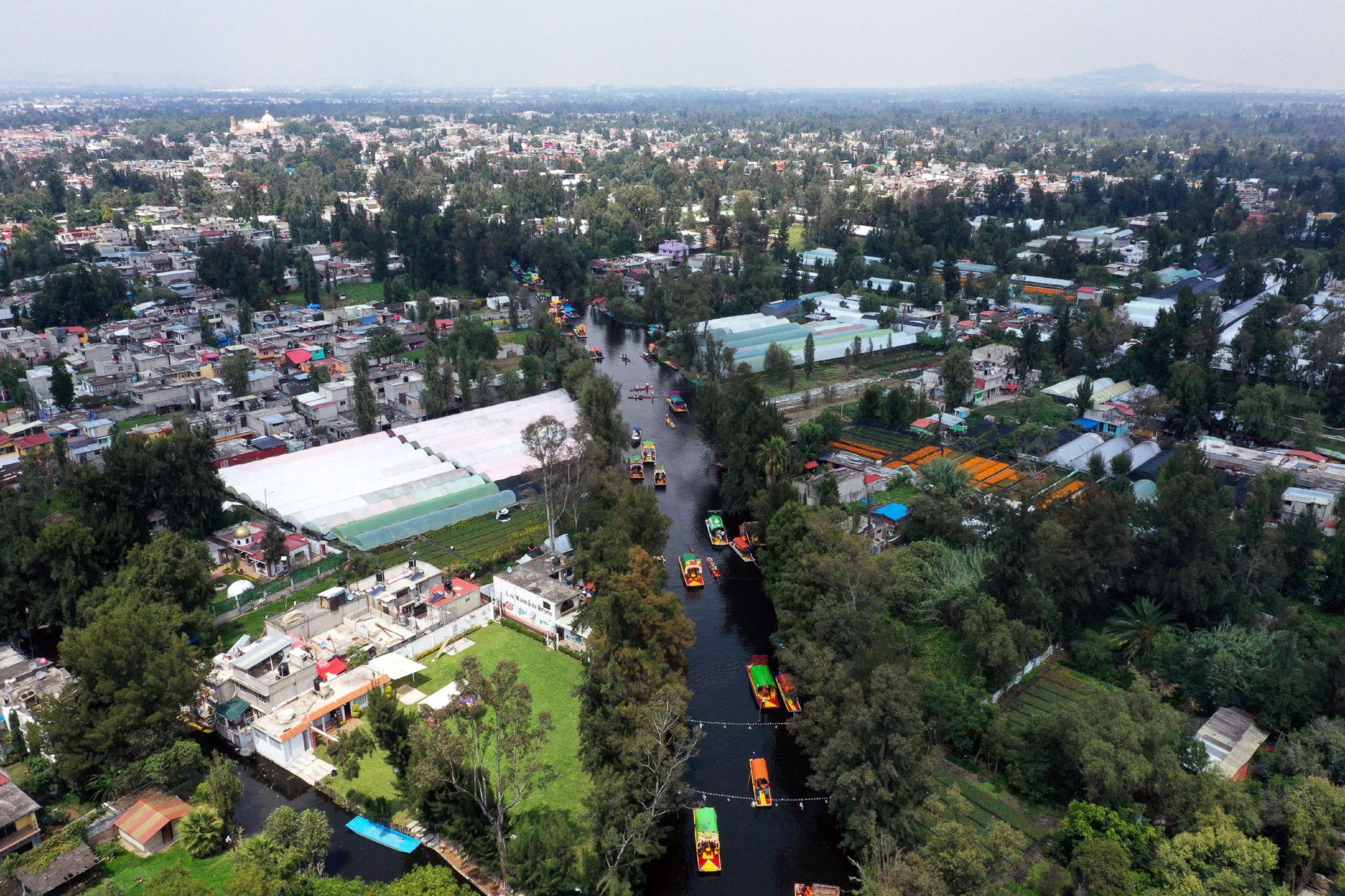 PHOTO: Aerial view of 'Trajineras' in Xochimilco, Mexico City, on Oct. 5, 2019. - Xochimilco, a network of canals and floating gardens that is one of Mexico City's top tourist attractions.