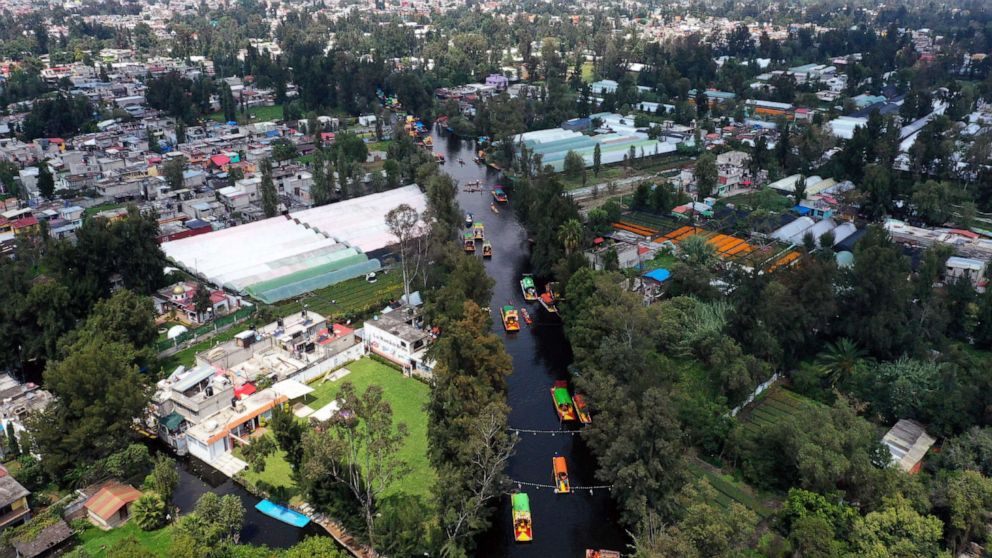 PHOTO: Aerial view of 'Trajineras' in Xochimilco, Mexico City, on Oct. 5, 2019. - Xochimilco, a network of canals and floating gardens that is one of Mexico City's top tourist attractions.