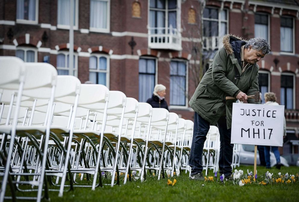 PHOTO: Relatives of victims of the Malaysia Airlines flight MH17 crash hold a silent protest with 298 empty seats in front of the Russian embassy in The Hague, The Netherlands, March 8, 2020.