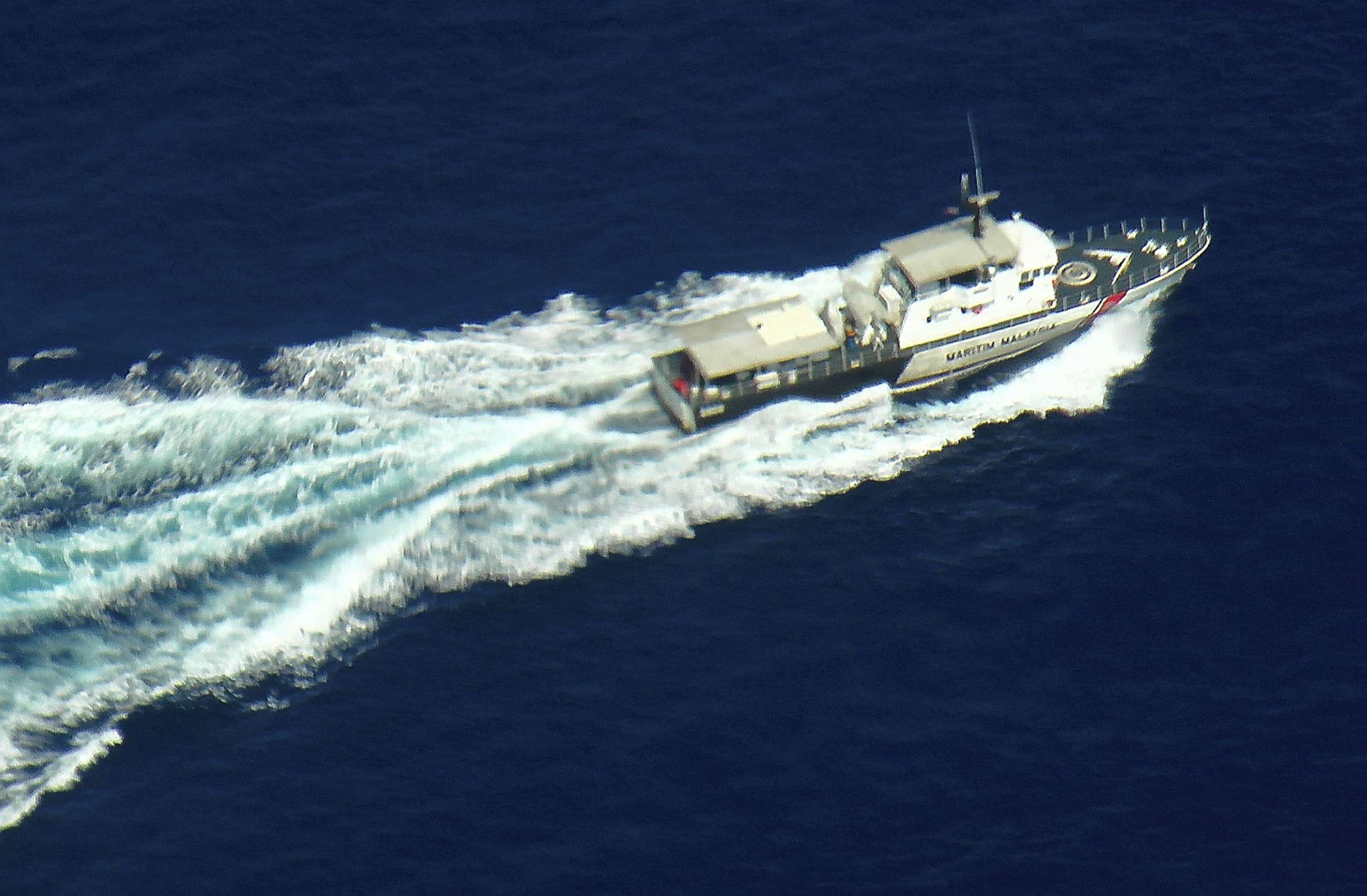 PHOTO: A patrol vessel of Malaysian Maritime Enforcement Agency participates in the search and rescue mission for Malaysia Airlines flight MH370 on March 9, 2014 off the Kelantan coast, Malaysia.