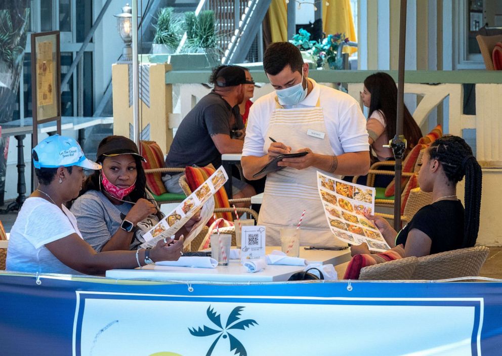 PHOTO: People order food in the On Ocean 7 cafe in Miami beach, Fla.,July 8, 2020.