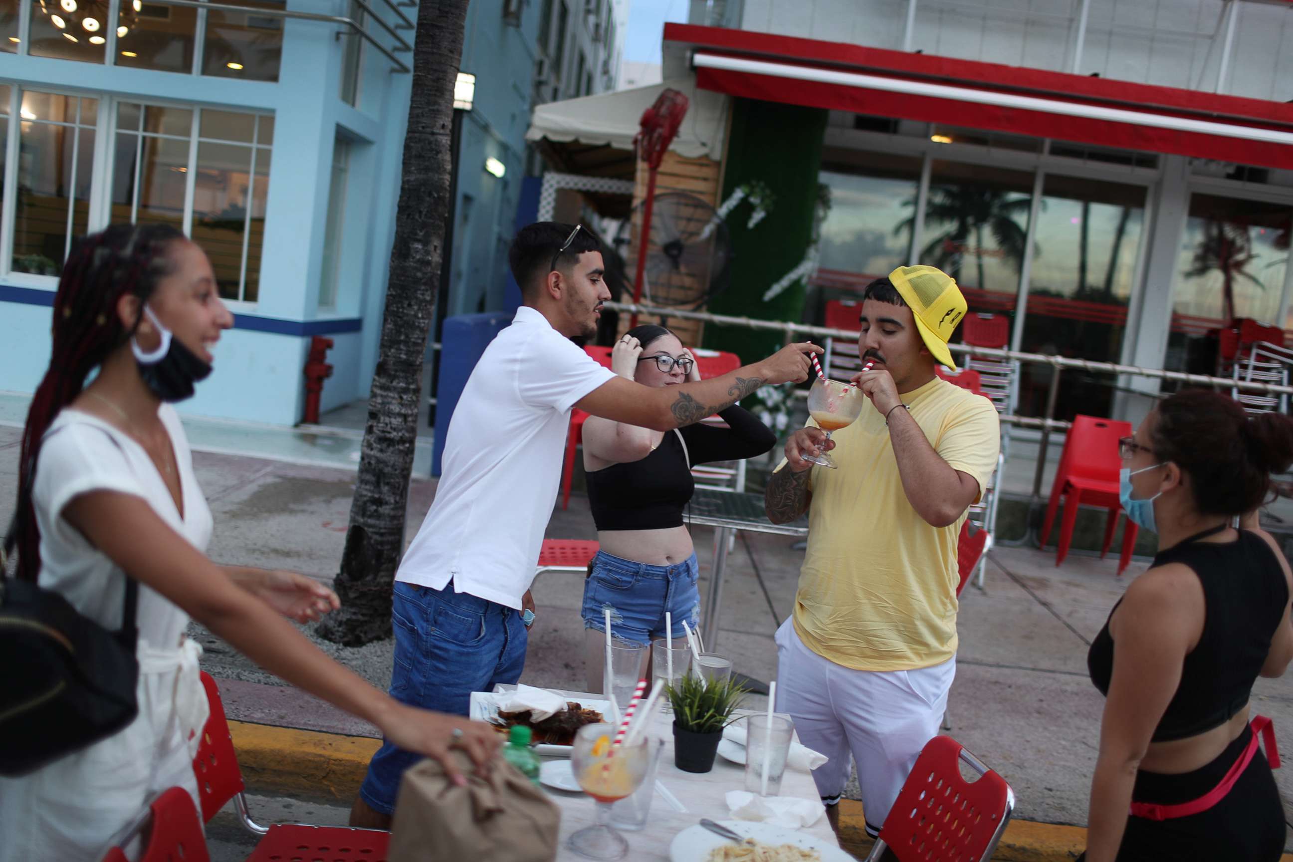 PHOTO: In this July 18, 2020, file photo, people finish their drinks at the Boulevard Hotel restaurant as a curfew from 8pm to 6am is put in place in Miami Beach, Fla.