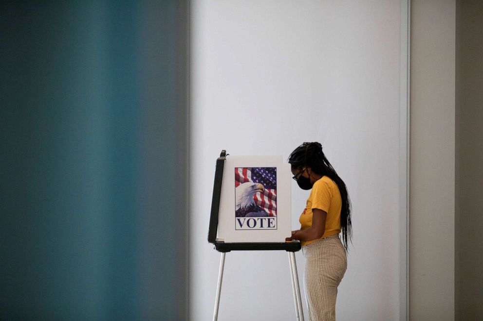 PHOTO: A person votes in the upcoming presidential elections as early voting begins in Ann Arbor, Mich., Sept. 24, 2020.