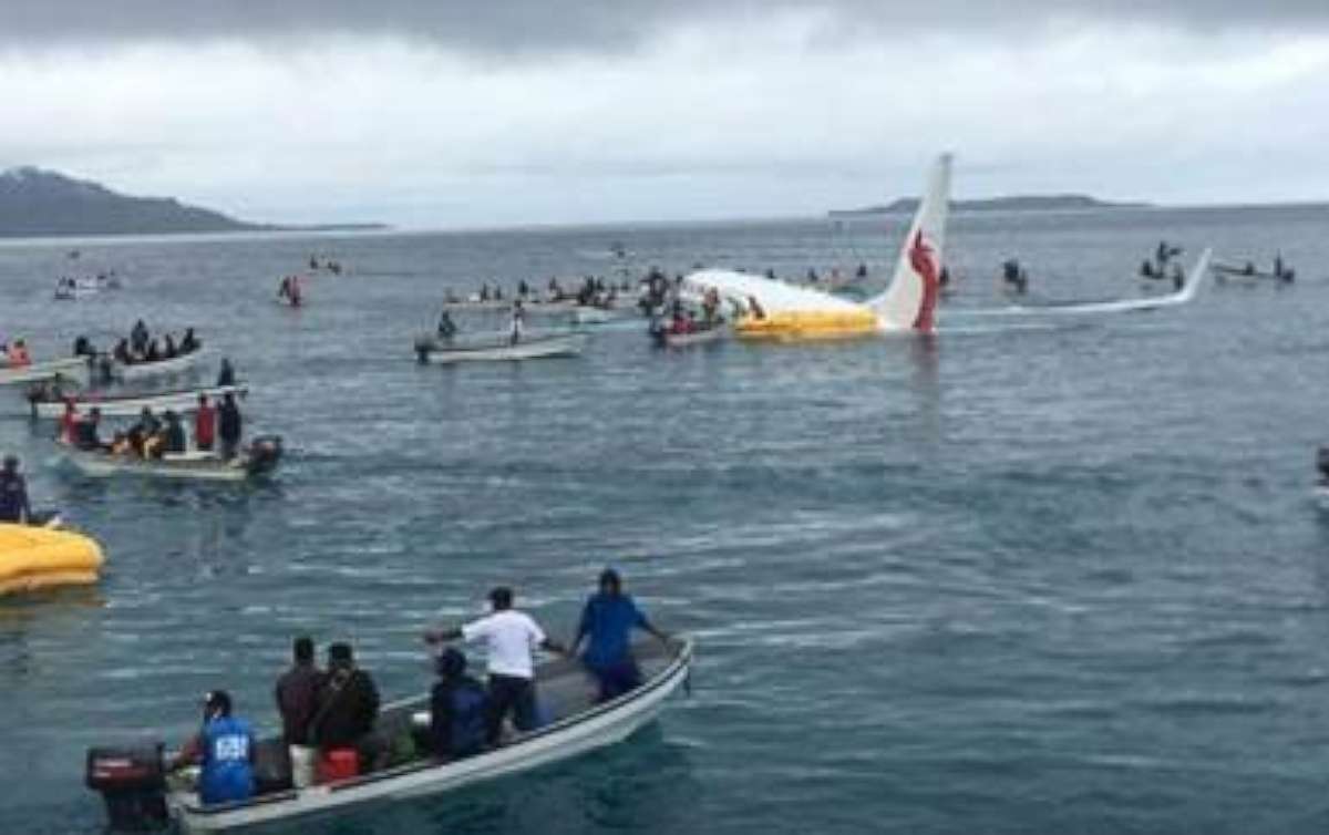 No serious injuries initially were reported after a jet landed short of a runway off the coast of Micronesia.