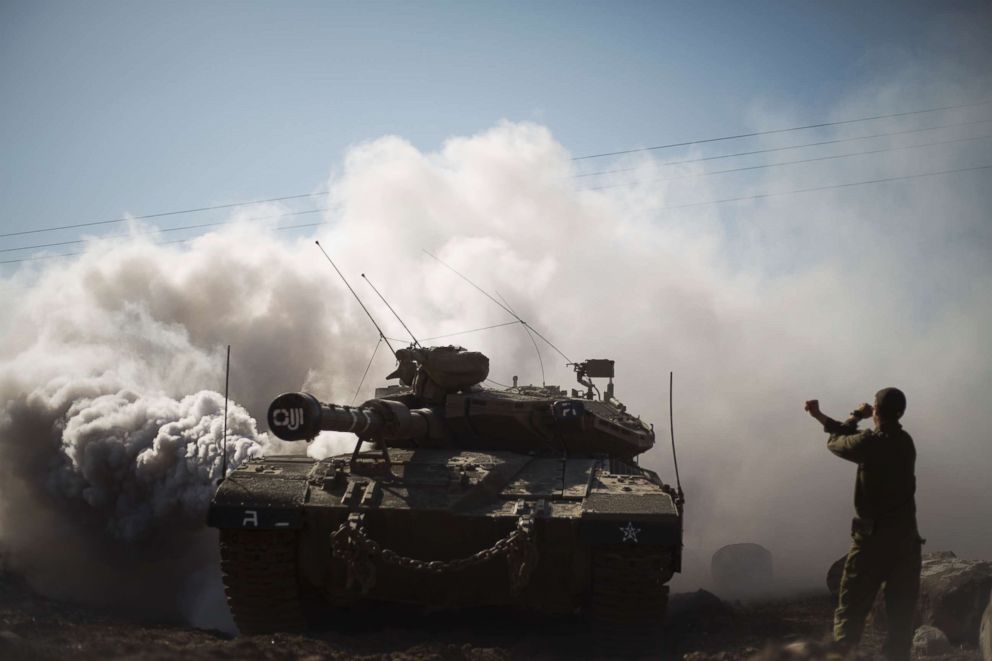 PHOTO: An Israeli soldier directs a tank near the border with Syria in the Israeli-controlled Golan Heights, Nov. 28, 2016.  